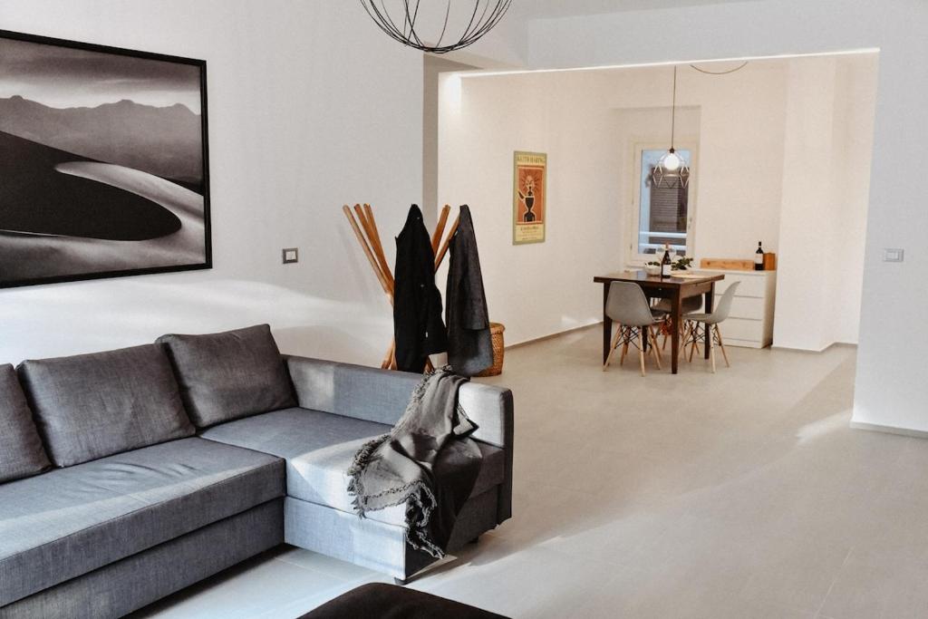 a living room with a couch and a table at Suite Grottabeach a due passi dal mare in Grottammare