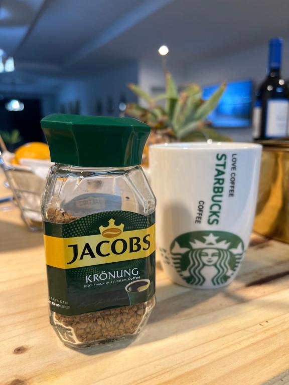 a jar of jacobs seasoning sitting on a table at ED Holiday Home- Chobe in Lesoma