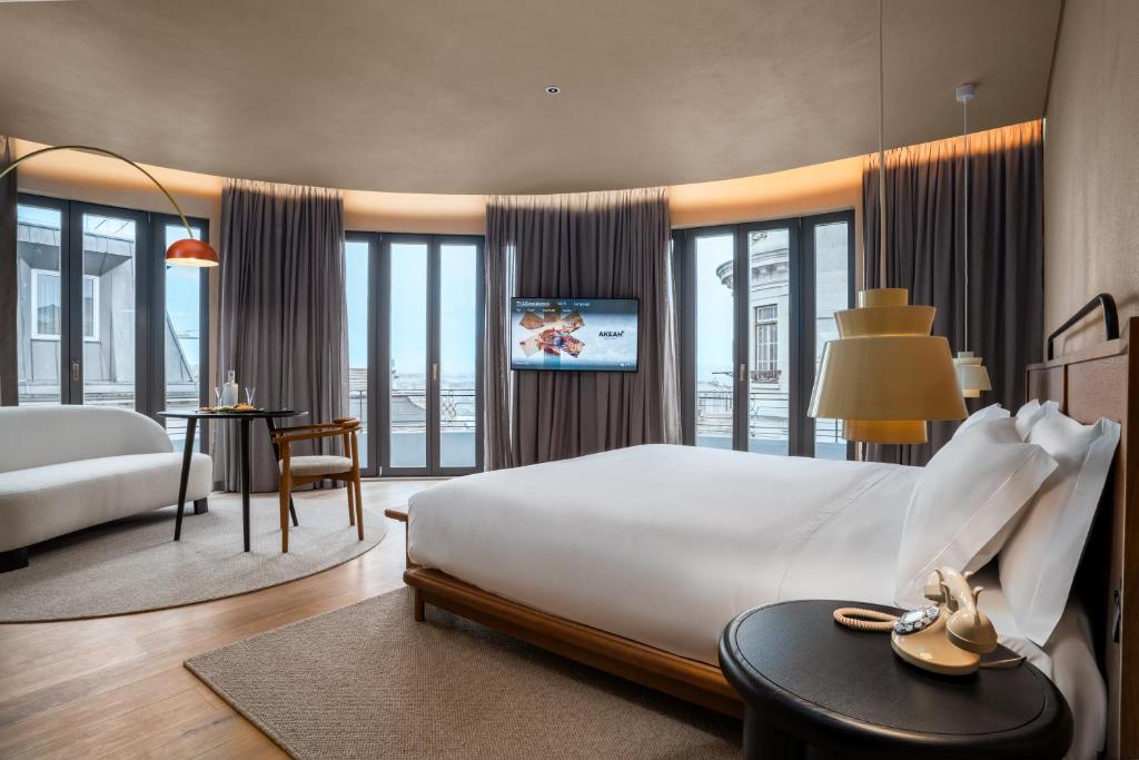 Ένα ή περισσότερα κρεβάτια σε δωμάτιο στο Akeah Porto Centro