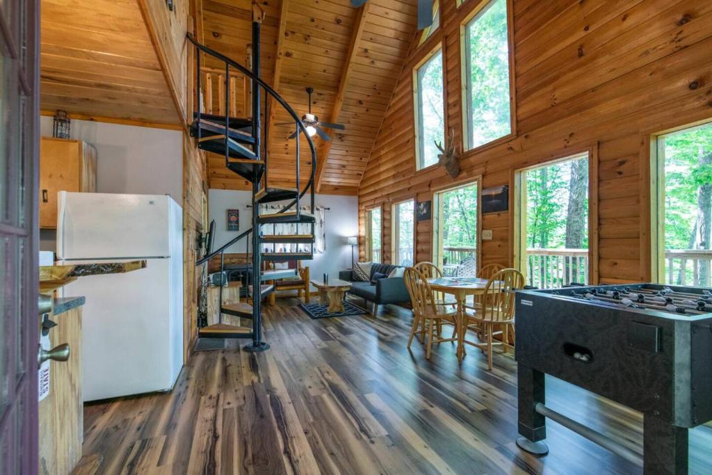 a kitchen and living room in a log cabin at Gorgeous View Cabin - in Red River Gorge KY in Slade