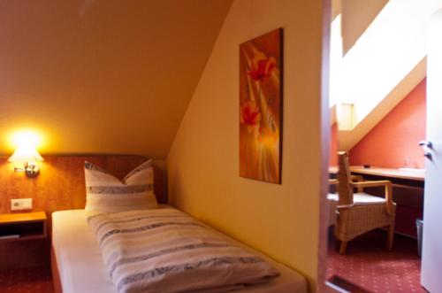 Postel nebo postele na pokoji v ubytování Hotel Perler Hof