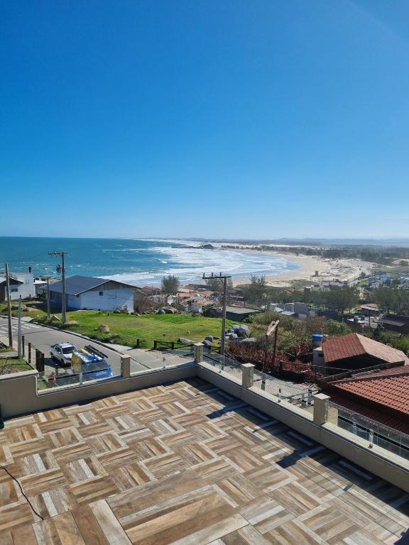 a view of the beach from the roof of a building at Apartment 202 Farol de Santa Marta in Laguna