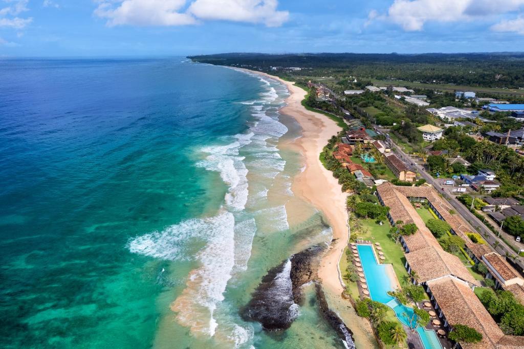 an aerial view of the beach and the ocean at The Fortress Resort & Spa in Ahangama