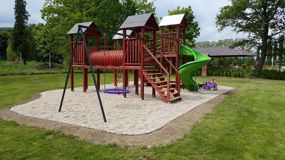 a playground with a slide in a park at Sport centrum na hřišti in Golčŭv Jeníkov