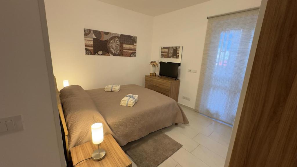 Una cama o camas en una habitación de Vito's House