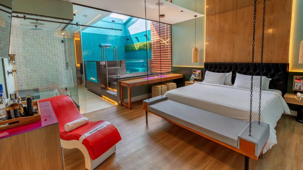 Ένα ή περισσότερα κρεβάτια σε δωμάτιο στο Liv Motel Ecuador