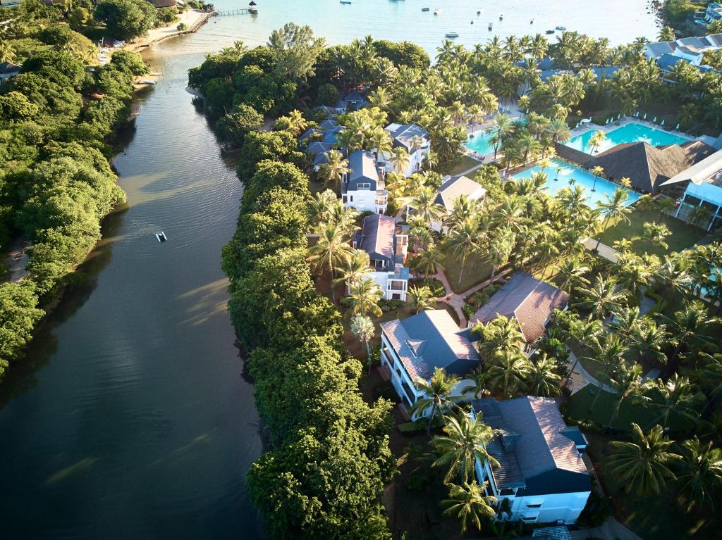 an aerial view of a resort next to a river at The Ravenala Attitude in Balaclava