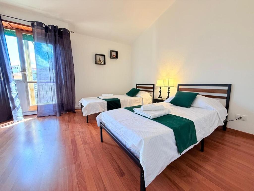 Postel nebo postele na pokoji v ubytování Pausania Luxury Ferrini Apartment