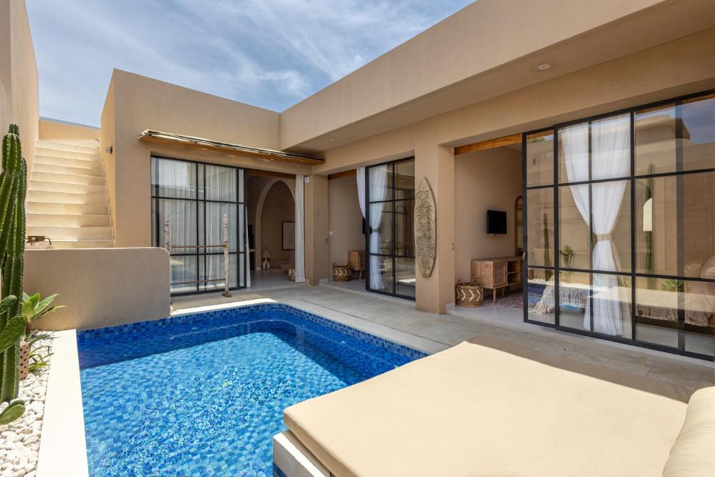 a house with a swimming pool in a yard at Pasir 2 - A stylish 2 bed villa in Bingin w pool in Bingin Beach