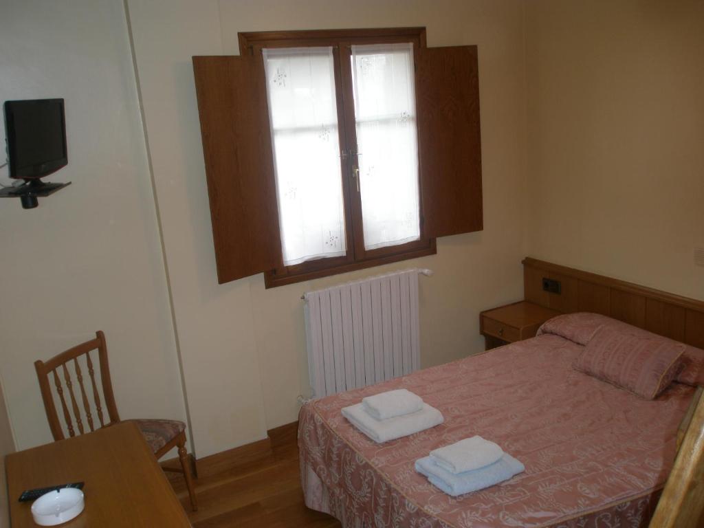 Postel nebo postele na pokoji v ubytování Hostal Musunzar