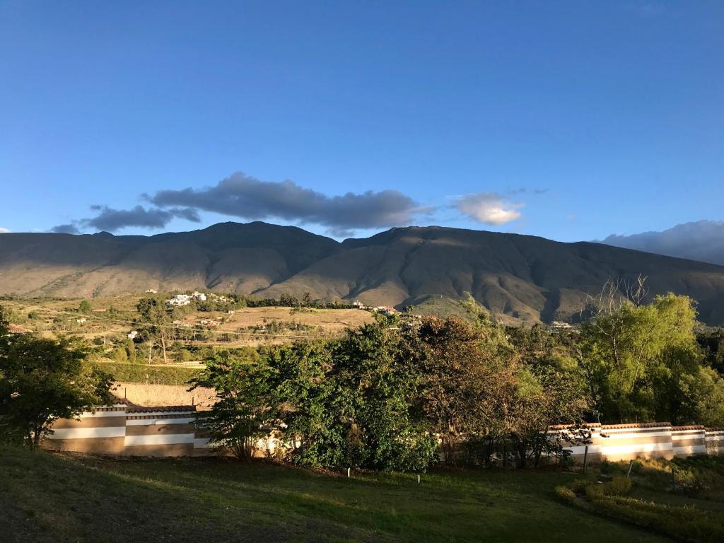 a view of a valley with mountains in the background at Hacienda Cascanueces in Villa de Leyva