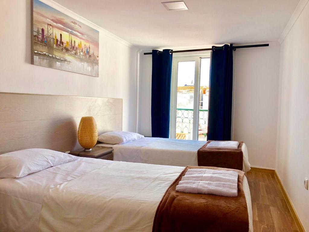 Ένα ή περισσότερα κρεβάτια σε δωμάτιο στο 02Lisbon Downtown Private Bedroom River View