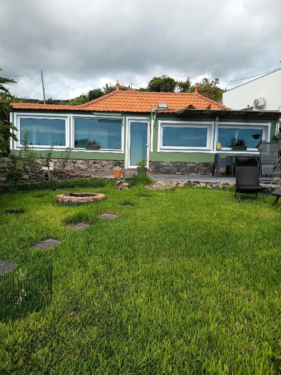 a house with a yard with green grass at The Goat's Place III in Gaula