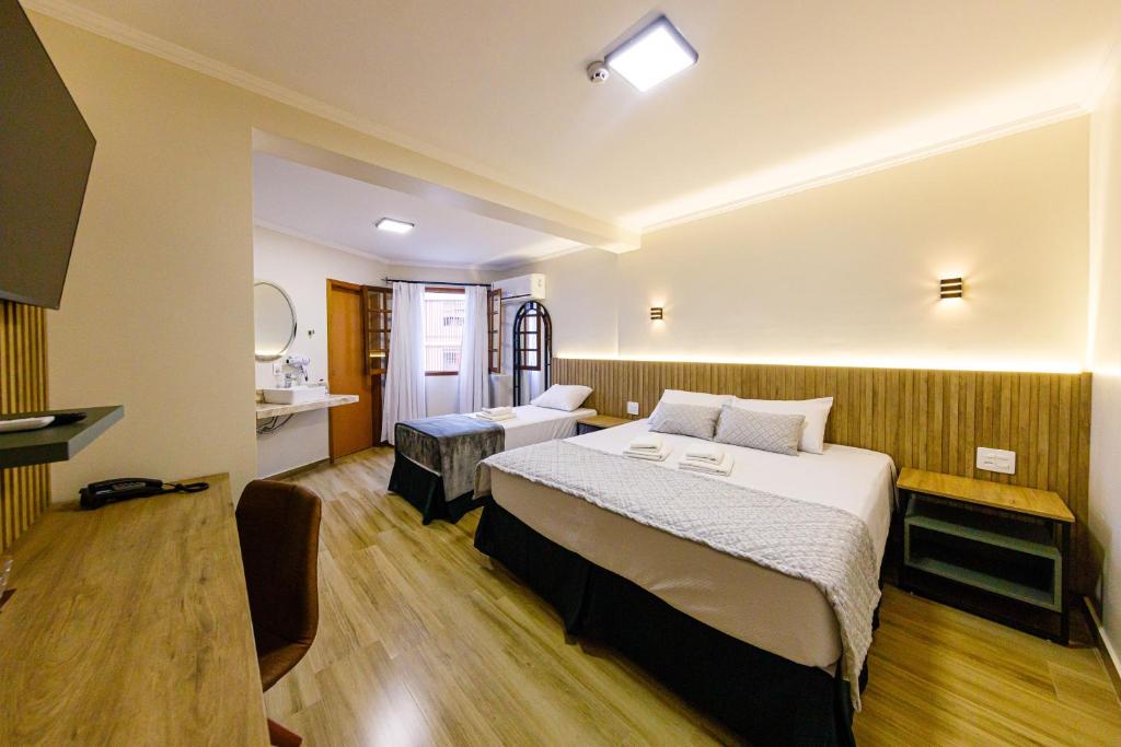 Ένα ή περισσότερα κρεβάτια σε δωμάτιο στο Estalagem Portucale