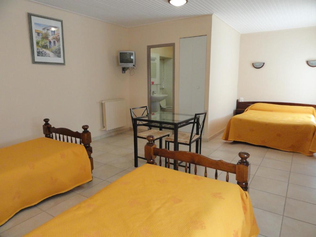 Postel nebo postele na pokoji v ubytování Hotel de l'île