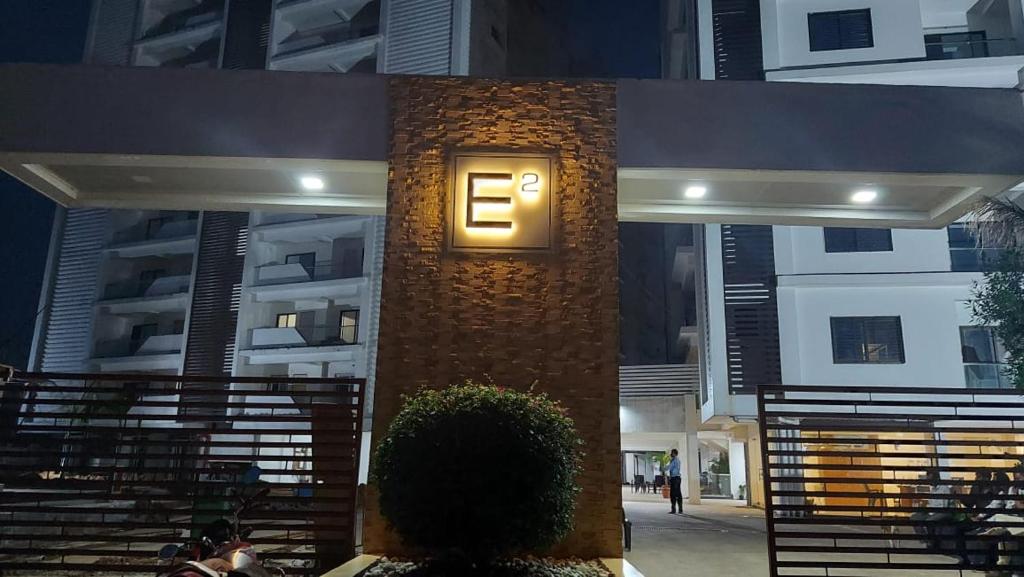 a building with a clock on the side of it at Elite Home Stay in Raipur