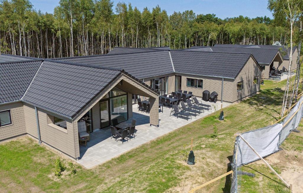 an overhead view of a home with a solar roof at Amazing Home In Glesborg With Sauna in Fjellerup
