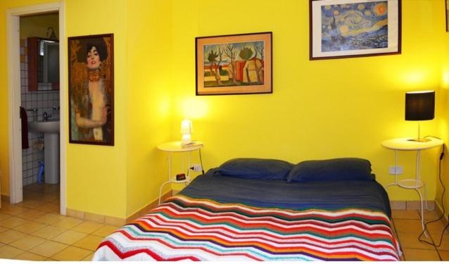 Postel nebo postele na pokoji v ubytování Eurialo Green Suites