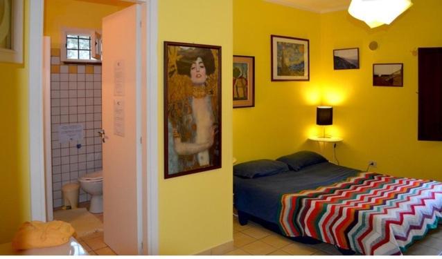 Postel nebo postele na pokoji v ubytování Eurialo Green Suites
