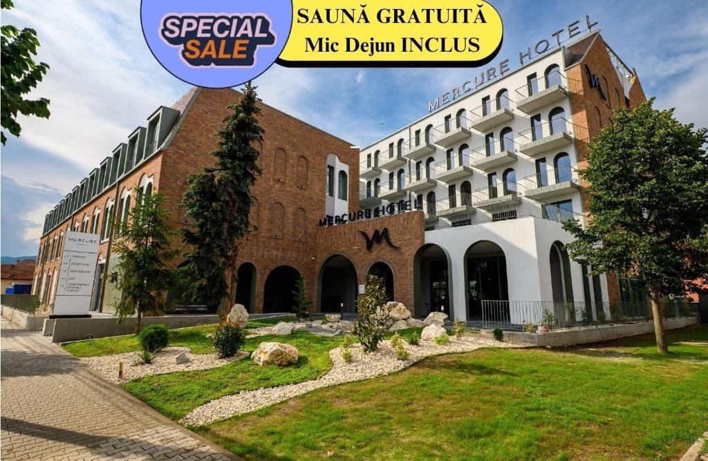 a building with a sign that reads special sale in front of it at Mercure Alba Iulia in Alba Iulia