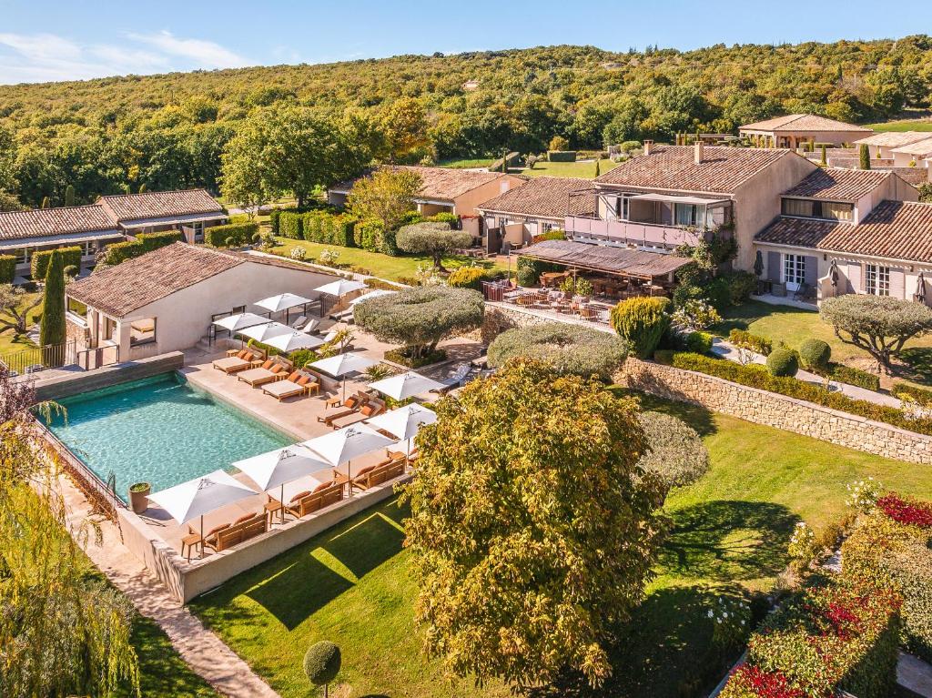 an aerial view of a house with a swimming pool at La Bastide Saint Georges & Spa in Forcalquier