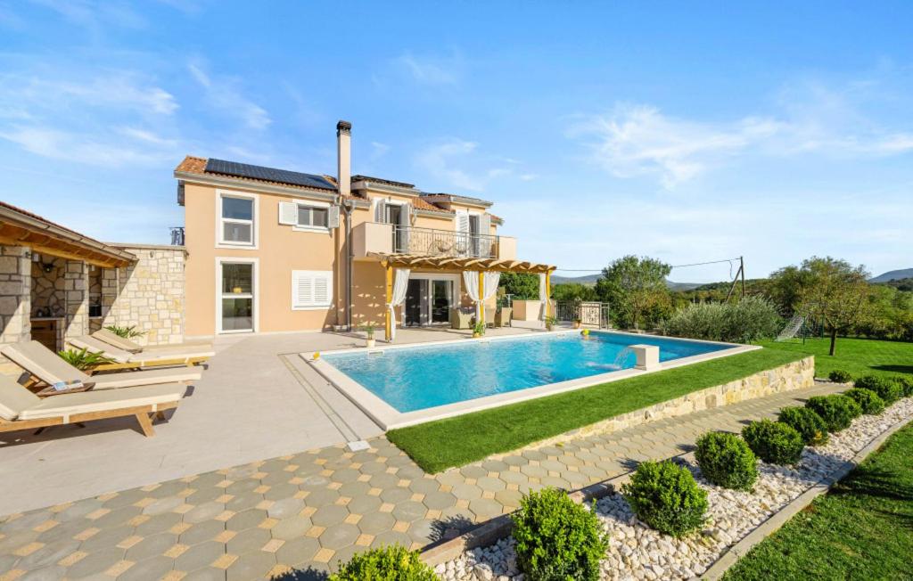a villa with a swimming pool in a yard at Villa Pleter by Villas Guide in Otavice