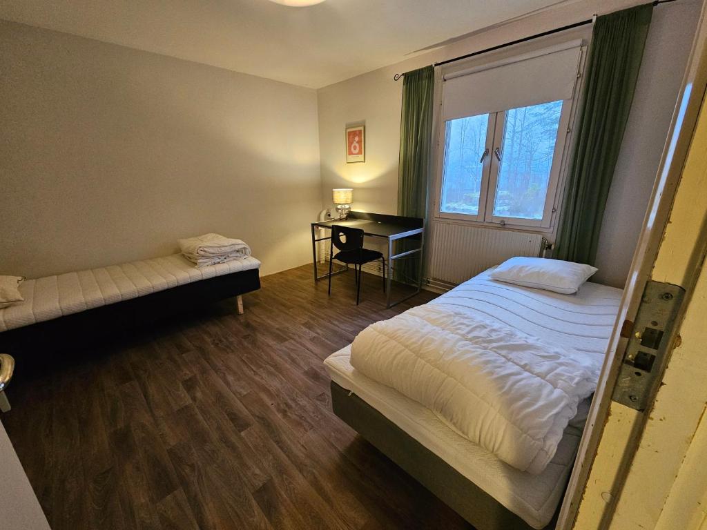 Ένα ή περισσότερα κρεβάτια σε δωμάτιο στο Storgatan 61 Jokkmokk