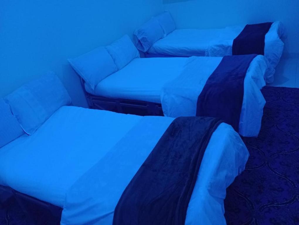 Postel nebo postele na pokoji v ubytování البيت بيتك للضيافة الخاصة