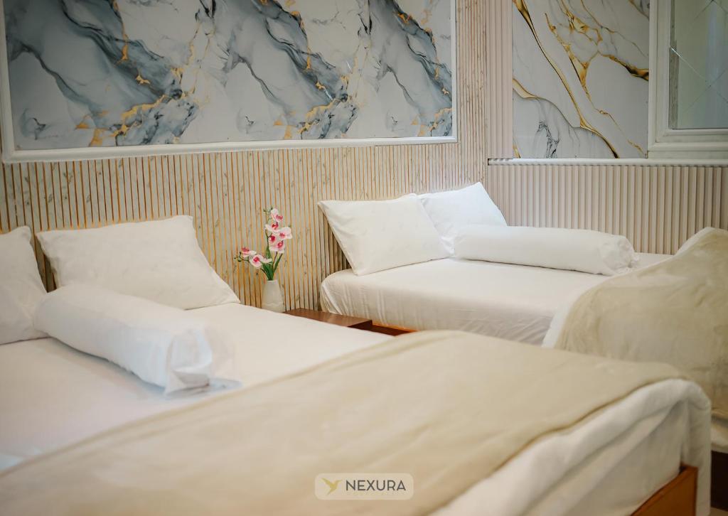 Un ou plusieurs lits dans un hébergement de l'établissement Grand House Nexura Collection