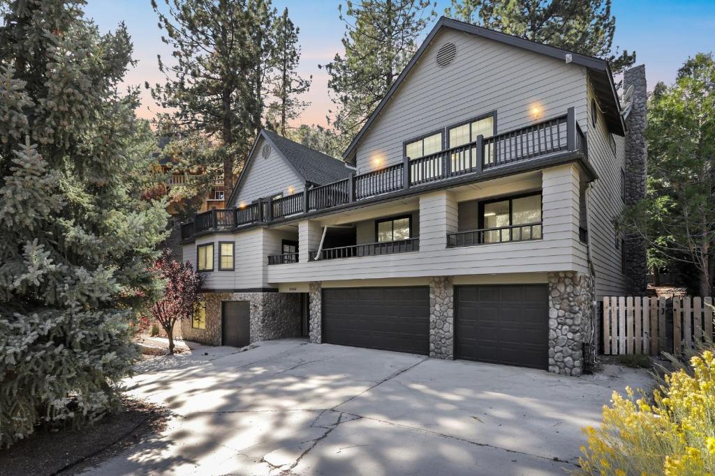 a large white house with a large driveway at Spacious Mountain Getaway Game Room & Gazebo villa in Pine Mountain Club