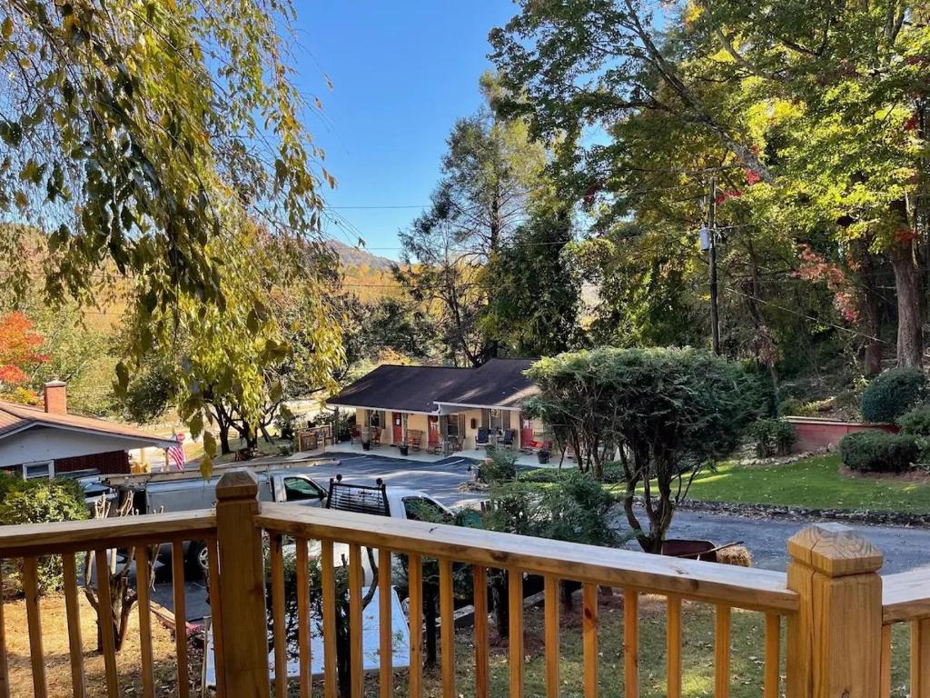 a view of a house from a wooden deck at Mountain Aire Cottages, Inn, & Glamping in Clayton