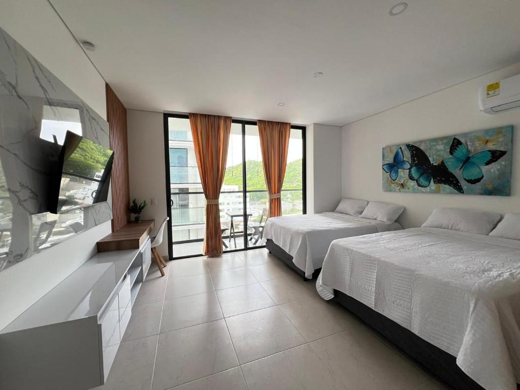 Ένα ή περισσότερα κρεβάτια σε δωμάτιο στο Exclusivo Apartamento en Santa Marta