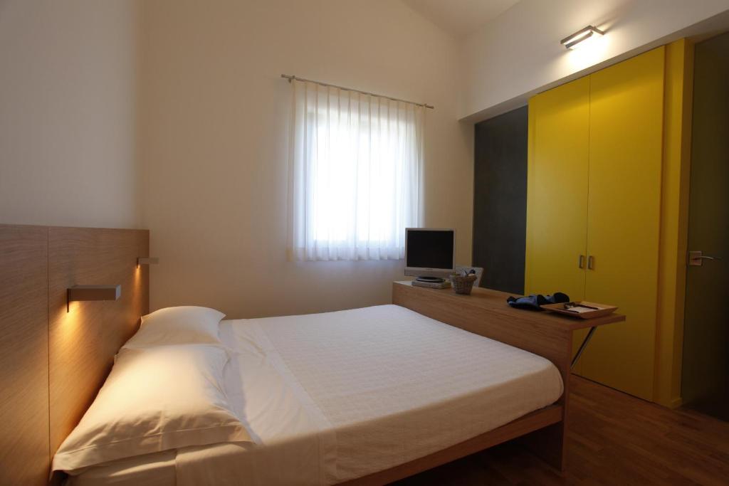 Postel nebo postele na pokoji v ubytování Acquarello