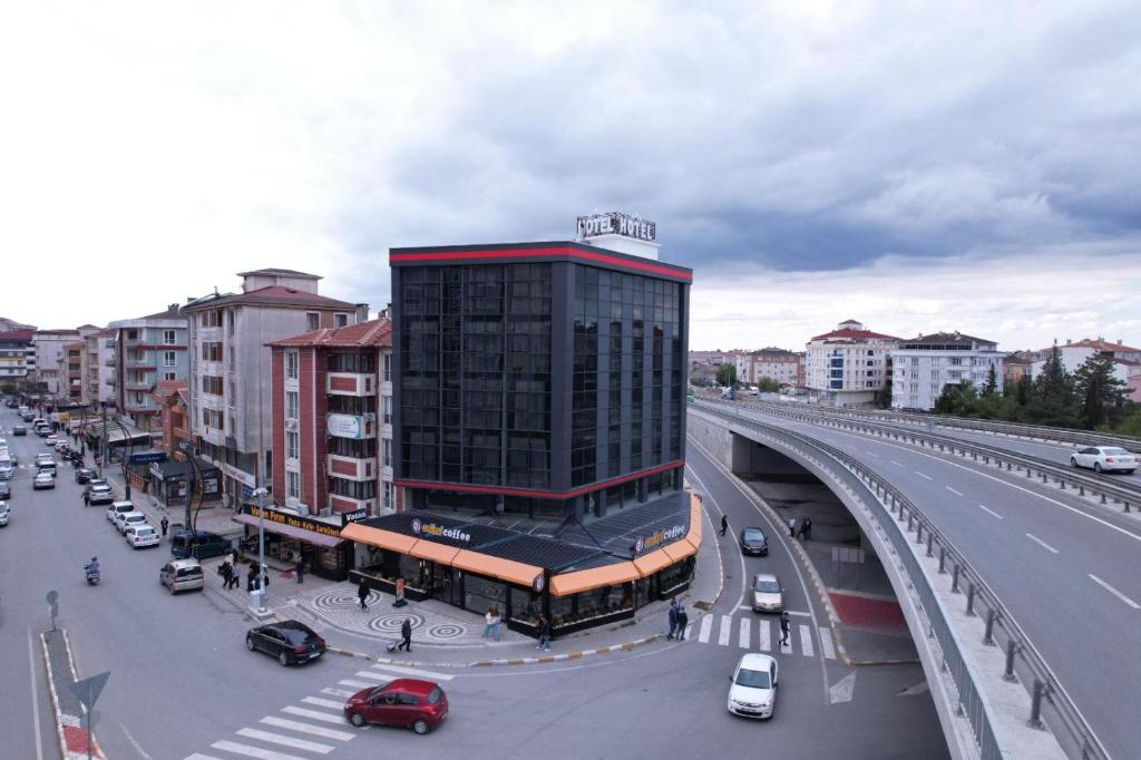 a city with a building and a street with cars at Kent Room Hotel in Kapaklı