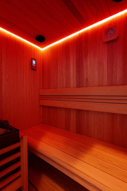 a room with a sauna with red lights at Bed Cinecittadue in Rome