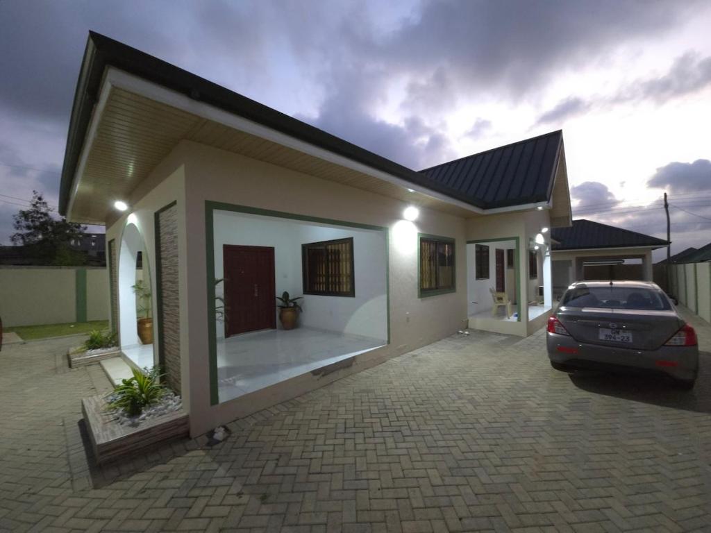 a car parked in front of a house at Lakeside Hilltop Haven -3 Bedroom House in Katamanso
