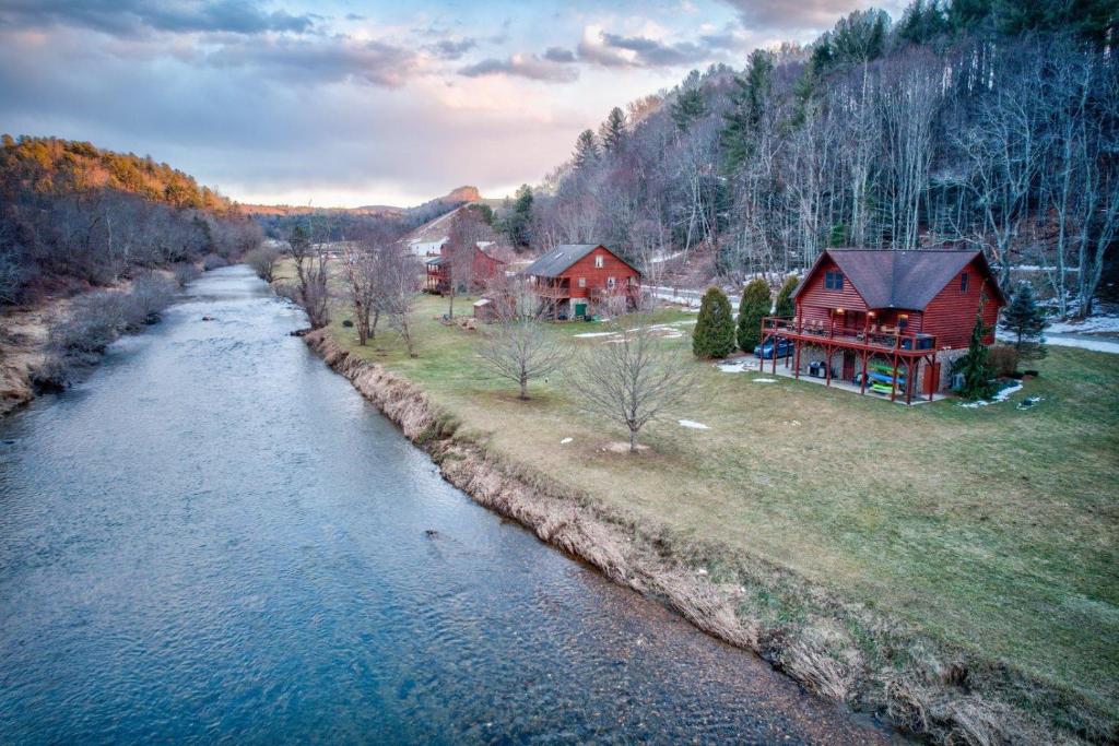 an aerial view of a house next to a river at River Roost in Todd