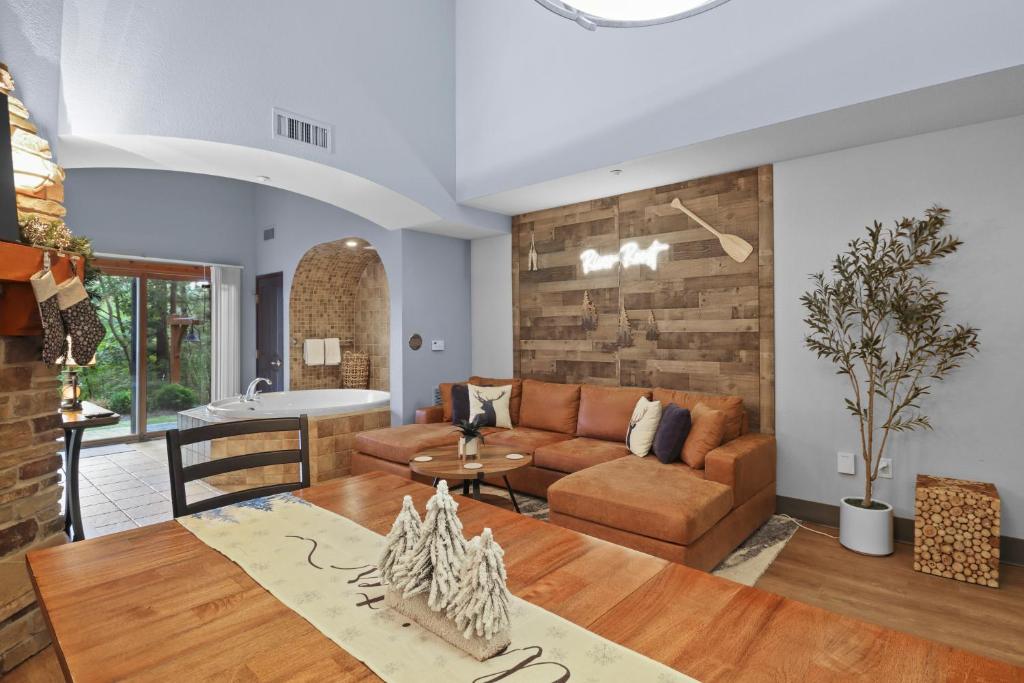 a living room with a couch and a table at Indoor Water Park - Game Rm - Mins to Downtown - Jacuzzi in Wisconsin Dells