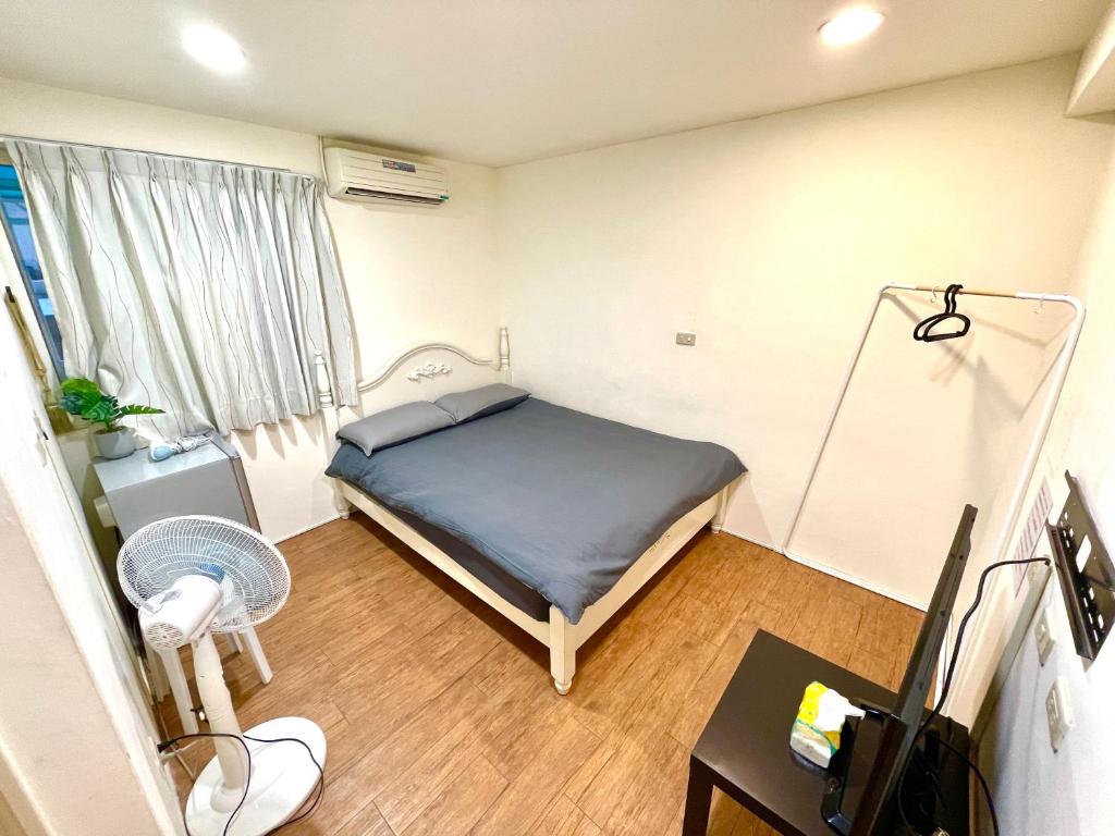 Ένα ή περισσότερα κρεβάτια σε δωμάτιο στο Fongchia Helsinki