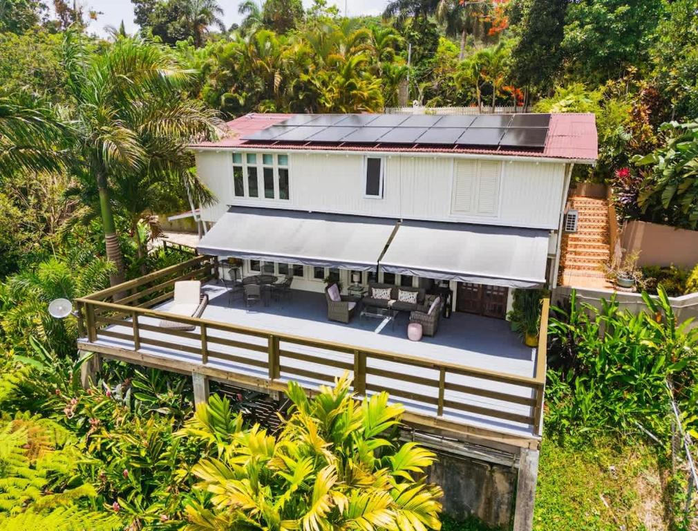 an aerial view of a house with solar panels on it at Chalet Lulu with Solar Power and Hot Tub in Guaynabo in Puerto Nuevo