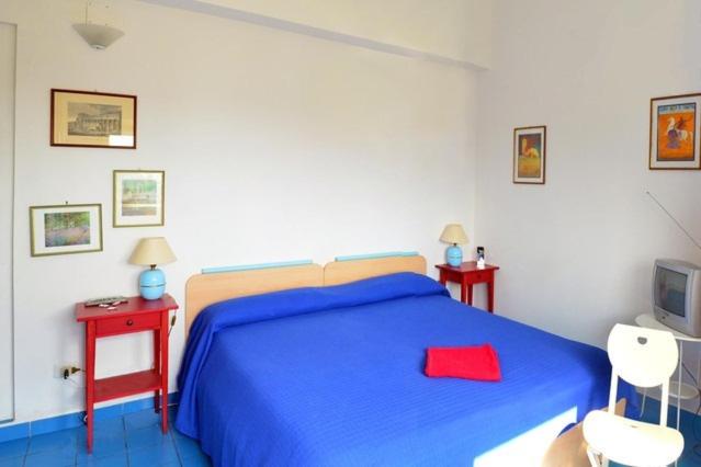 Postel nebo postele na pokoji v ubytování Eurialo Green Suites