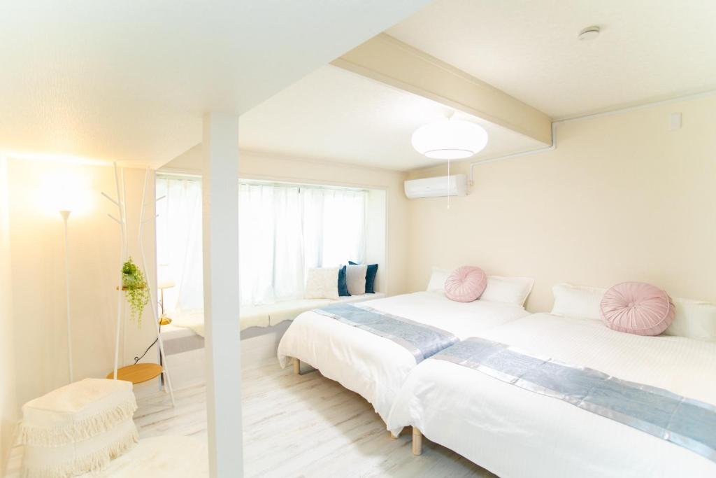 Un pat sau paturi într-o cameră la Yokkaichi - House - Vacation STAY 82024v
