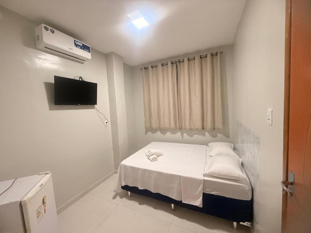 Postel nebo postele na pokoji v ubytování Sky Hotel Ltda