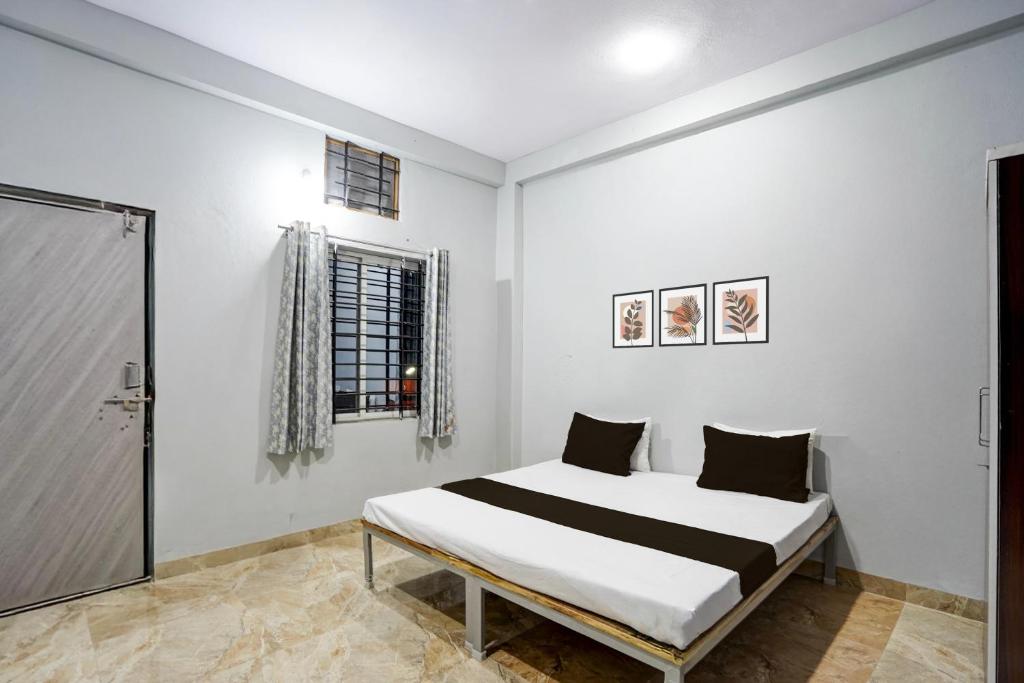 Ένα ή περισσότερα κρεβάτια σε δωμάτιο στο Hotel O Sangam Gardan