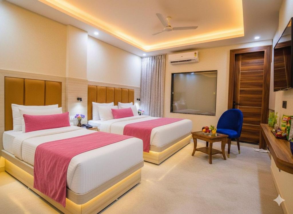 Postel nebo postele na pokoji v ubytování Luxe Shalimaar