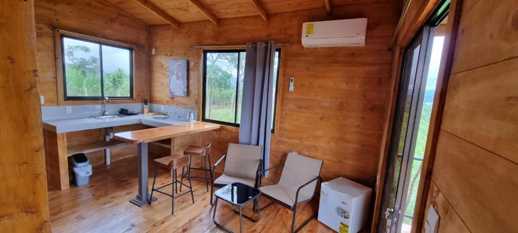a kitchen with a sink and a table in a room at Dulces Momentos PZ 