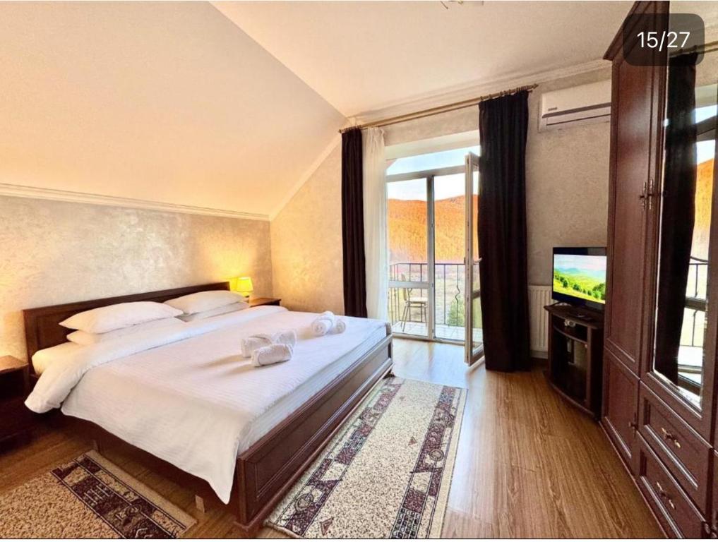 Postel nebo postele na pokoji v ubytování Садиба в ГОРАХ