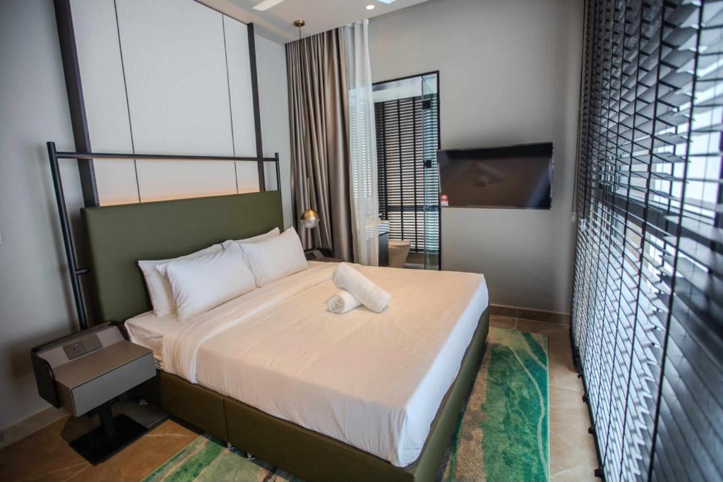 Postel nebo postele na pokoji v ubytování Antara Genting by J&H 3BR Entertainment Suite M1