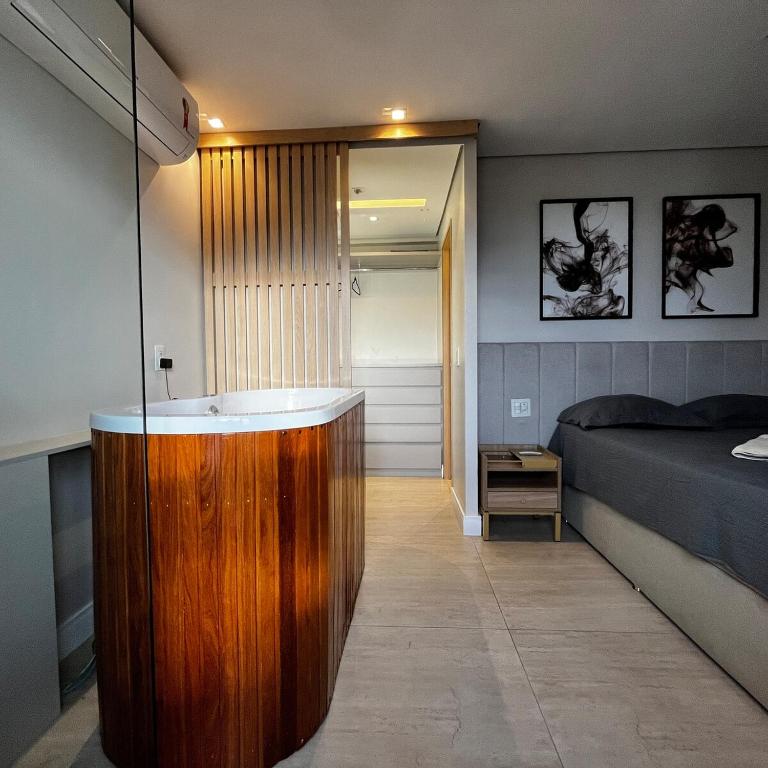 Χώρος καθιστικού στο Refúgio Executivo Exclusivo Duplex com Ofurô