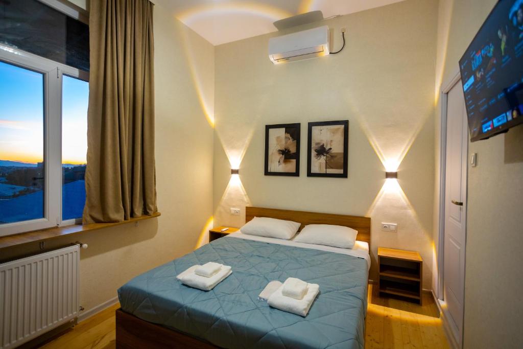 Ένα ή περισσότερα κρεβάτια σε δωμάτιο στο Edmar Boutique Stay